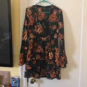 Cute floral ruffle dress .